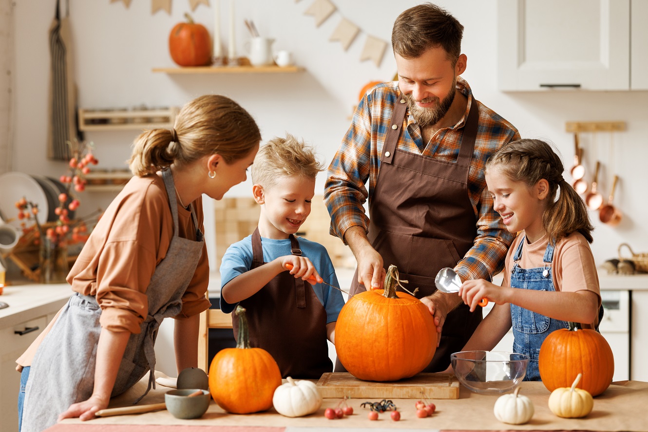 Family carving pumpkins